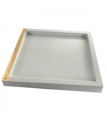 Vide-poche en béton coloré blanc.